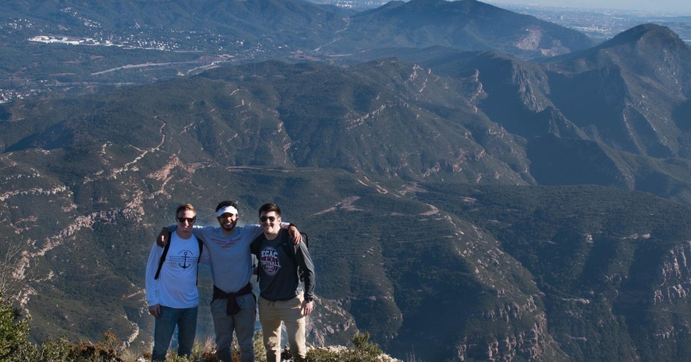 Quentin pictured with fellow mechanical engineering and football teammates on top of Montserrat, one of the two large mountains in Barcelona. The three studied abroad during the most recent winter break.