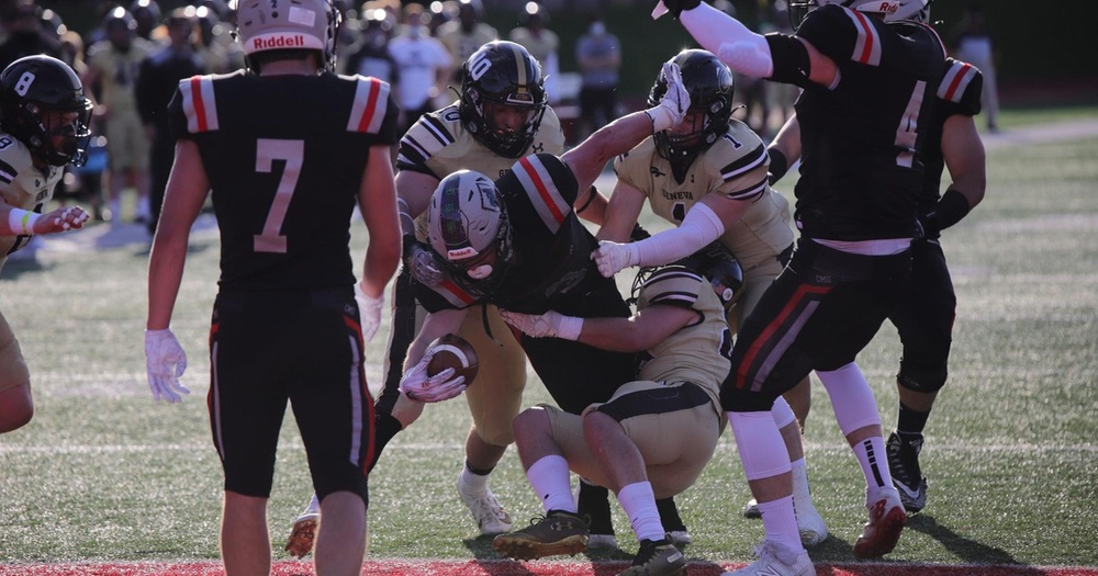 football player scores touchdown threw three players 