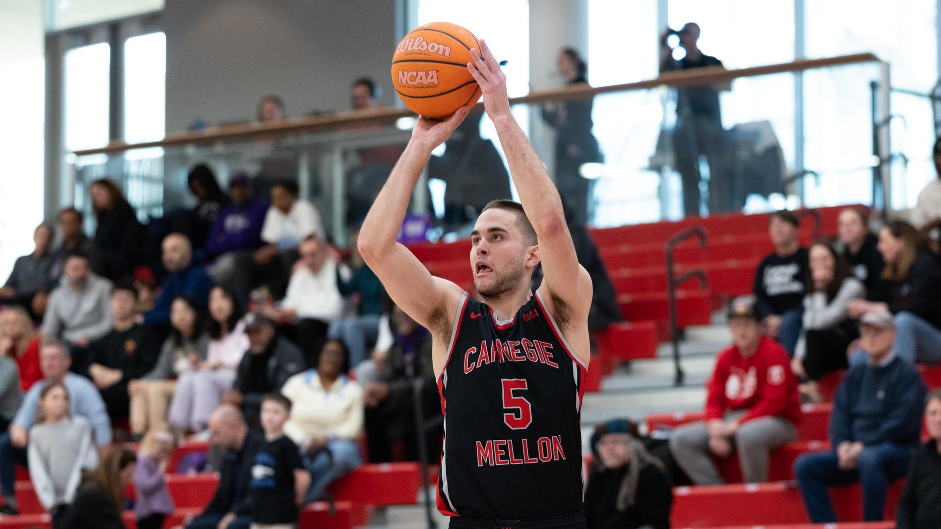 OT Thriller Falls to #25 NYU; DeJardin Records 1,000th Point