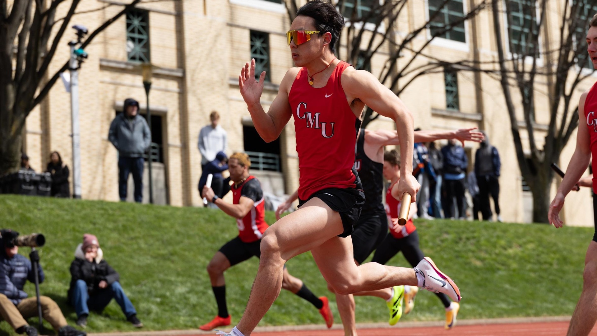men's track athlete running on the track