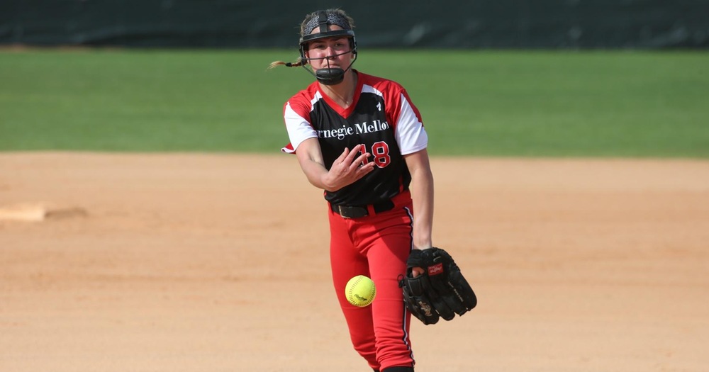 women's softball pitcher in follow-through after pitch