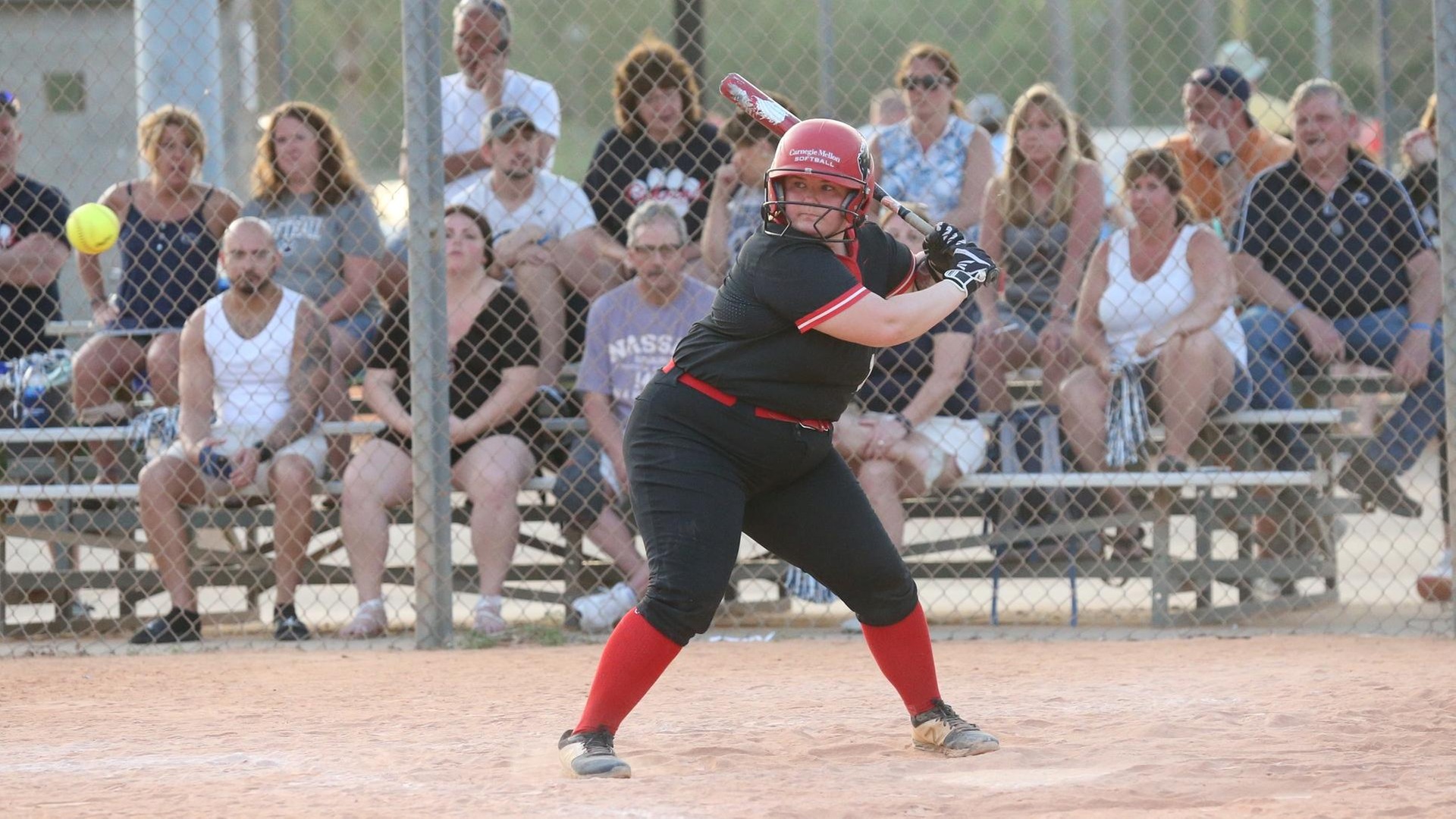 women's softball player at the plater waiting for the pitch