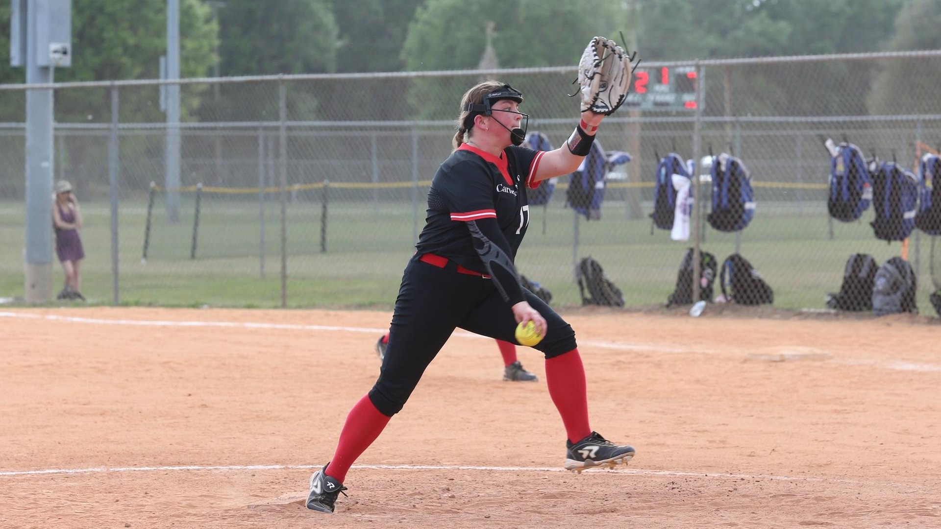 women's softball pitcher in motion