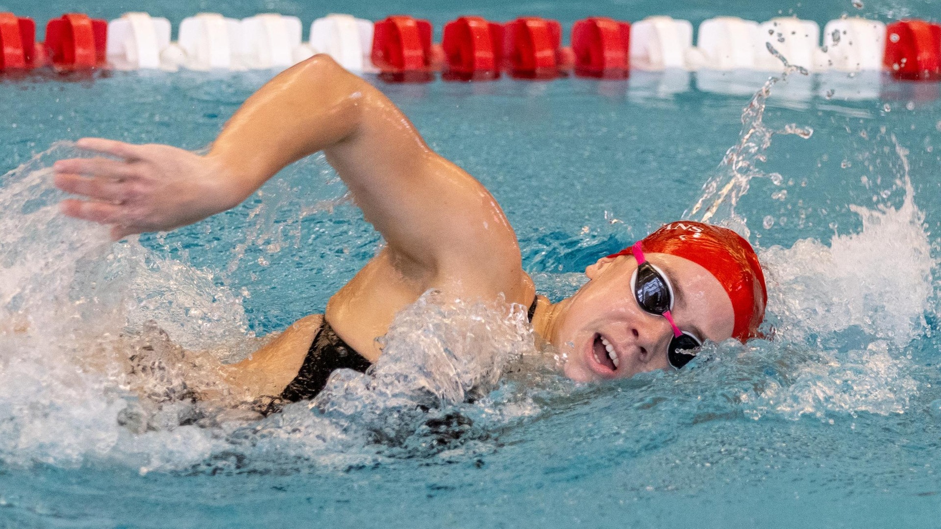 women's swimmer doing freestyle